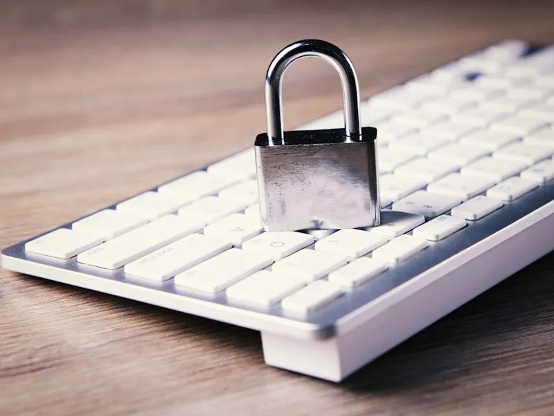 Padlock on keyboard representing IT compliance and data security