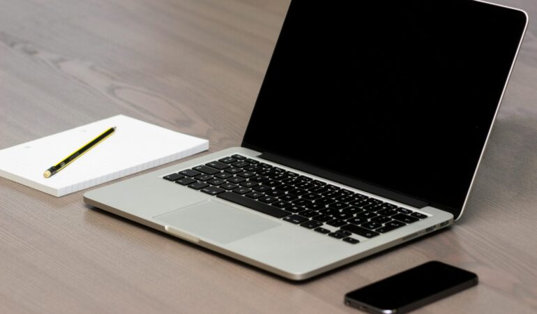 Free Silver Macbook Beside Iphone Stock Photo