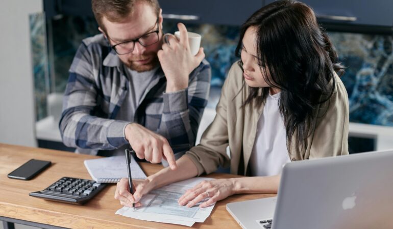 Free couple calculating al their bills stock photo