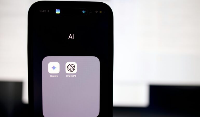 a close up of a cell phone with an ai button