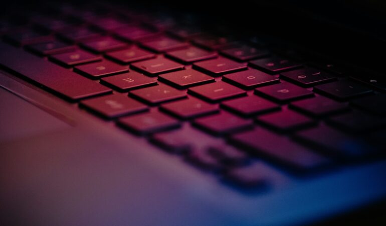 a-close-up-of-a-keyboard-with-a-blurry-background